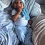 Chōzyn joined the competition — help win amazing prizes! baby, infant, smile, happy, blue_stripes, hat, bracelet, pacifier, blanket, soft, cozy, bed, pillow, child, cute, clothing, lying_down, indoors, playful, young