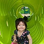 Anayelíz is registered to the contest to win money with this photo: child, toddler, playground, tunnel, green, smiling, outdoor, grass, park, shoes, dress, happy, people, crawling, fun, daylight, cute, play, recreation, nature