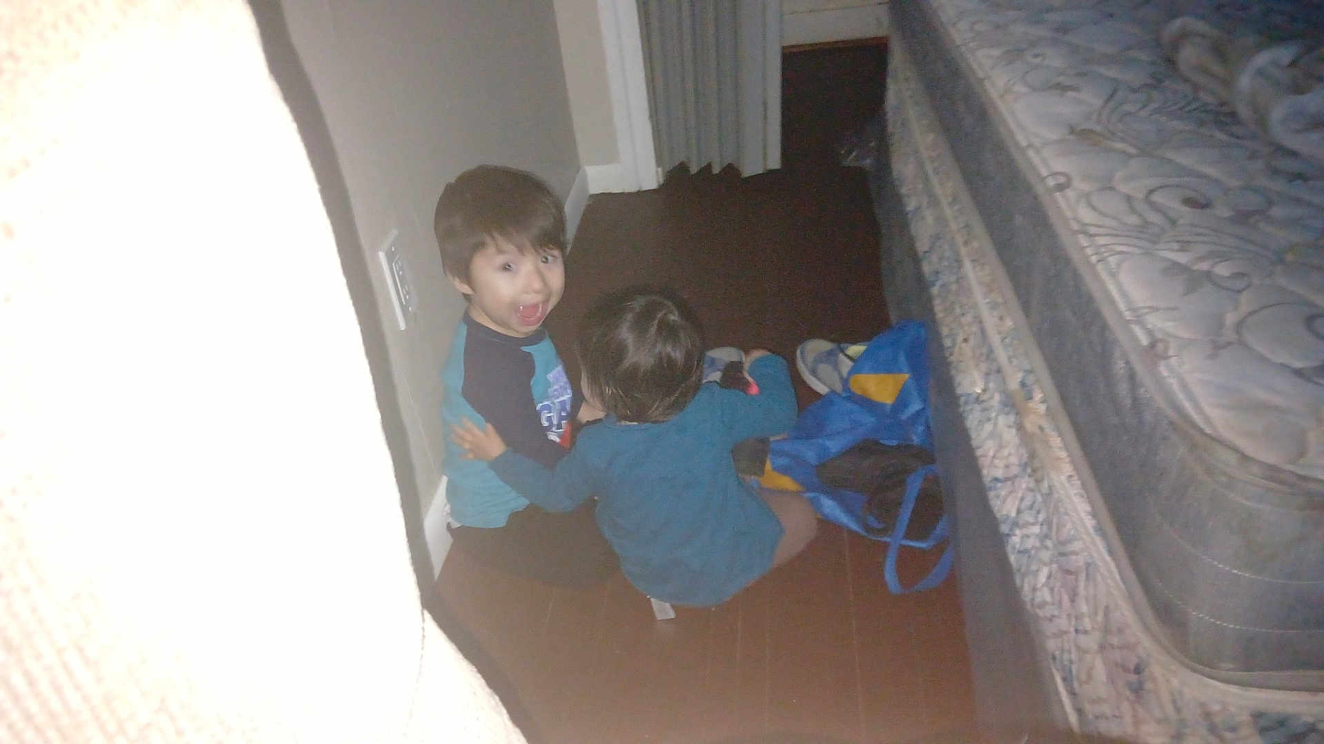 Misael joined the competition — help win amazing prizes! children, child, floor, bed, mattress, bag, wall, indoor, carpet, blue_clothing, dark_hair, playing, home, young, person, boy, sitting, expression, surprised, casual
