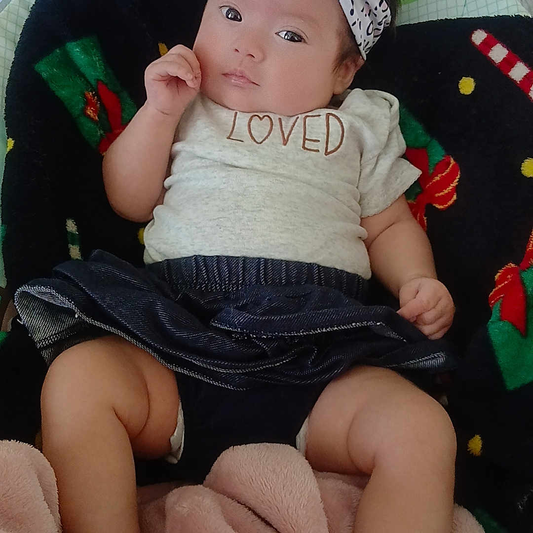 Mireya is registered to the contest to win money with this photo: baby, black, blanket, bow, child, clothing, cute, diapers, expression, floor, headband, indoor, infant, person, pink, portrait, relaxed, shirt, soft_texture, wooden_floor