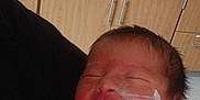 Mireya joined the competition — help win amazing prizes! newborn, baby, sleeping, hospital, feeding_tube, blanket, medical_equipment, infant, face, person, healthcare, caregiver, cabinet, room, indoors, cute, peaceful, child, taped_tube, wrapped