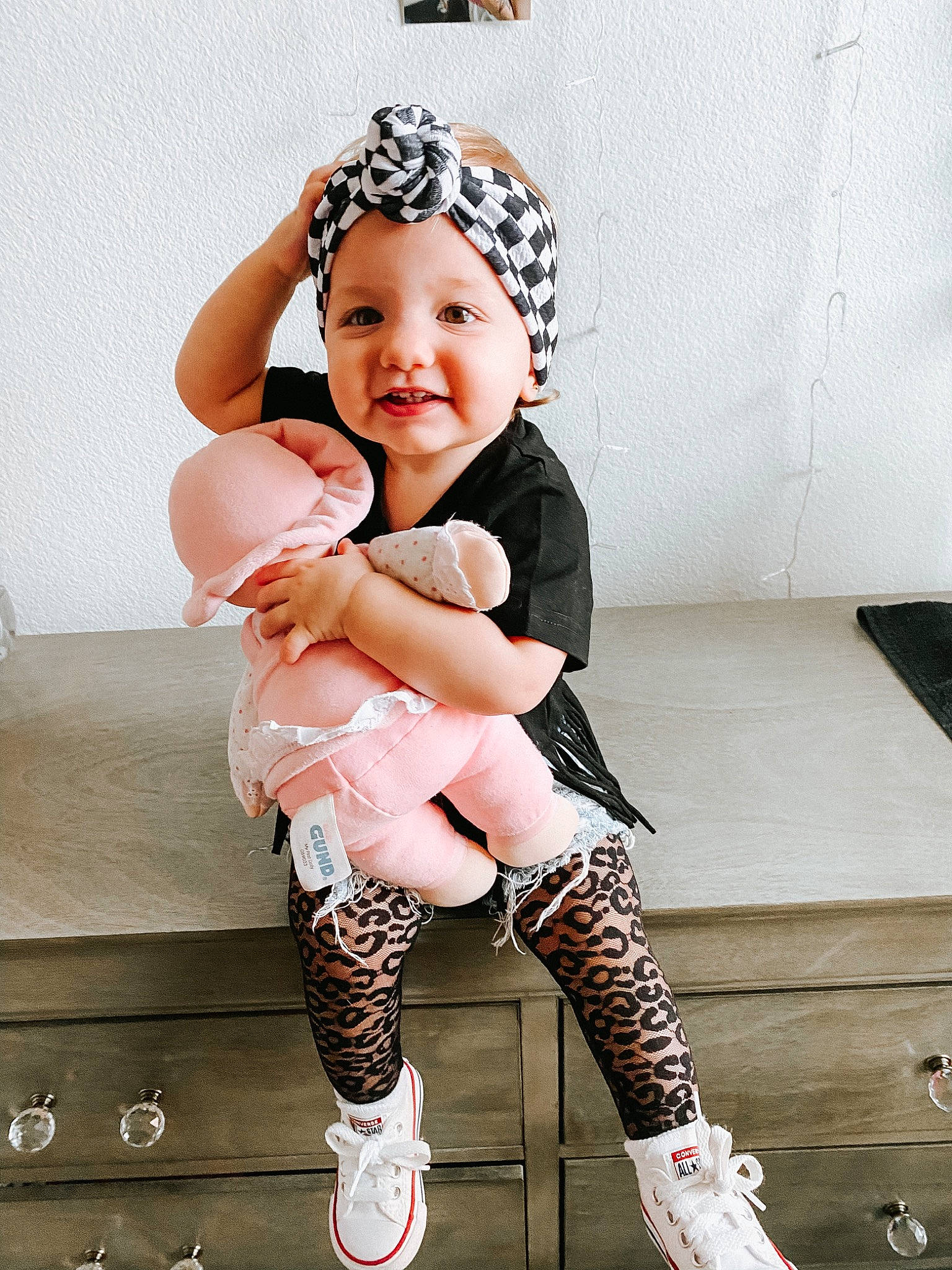 Kinlee is registered to the contest to win money with this photo: arm, baby, baby_toddler_clothing, beauty, cheek, child, child_model, design, footwear, hair_accessory, headgear, headwear, joint, knee, leg, leggings, person, pink, product, shoe