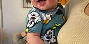 Messiah is registered to the contest to win money with this photo: adult, arm, baby, cabinet, child, closeup, clothing, cute, face, furniture, happy, headwear, holding, home, indoor, infant, person, portrait, smiling, warm_lighting
