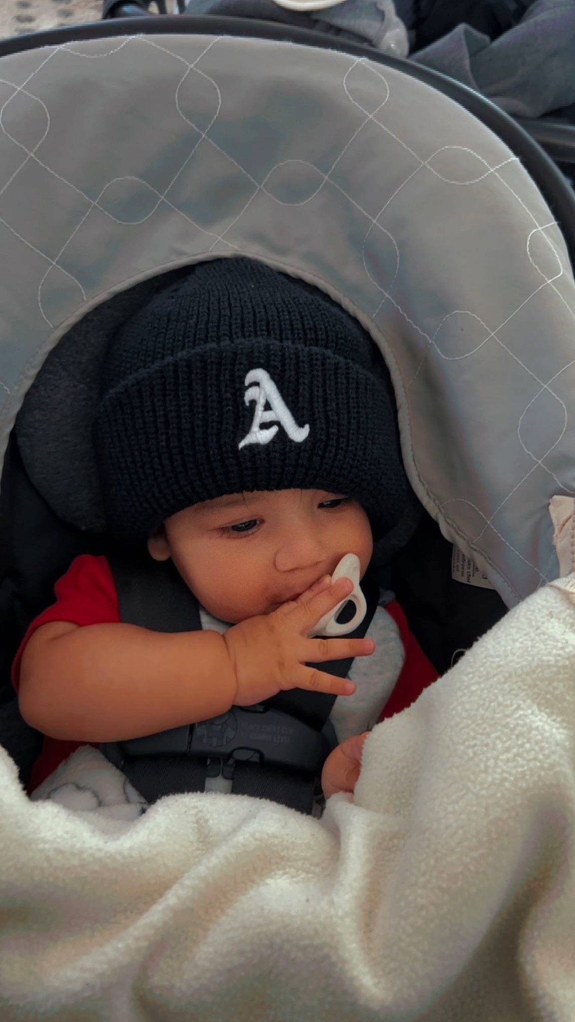 Aj joined the competition — help win amazing prizes! baby, baby_products, baby_toddler_clothing, baseball_cap, beanie, cap, carmine, comfort, cool, fashion_accessory, flash_photography, happy, hat, headgear, headwear, knit_cap, pattern, person, personal_protective_equipment, sitting