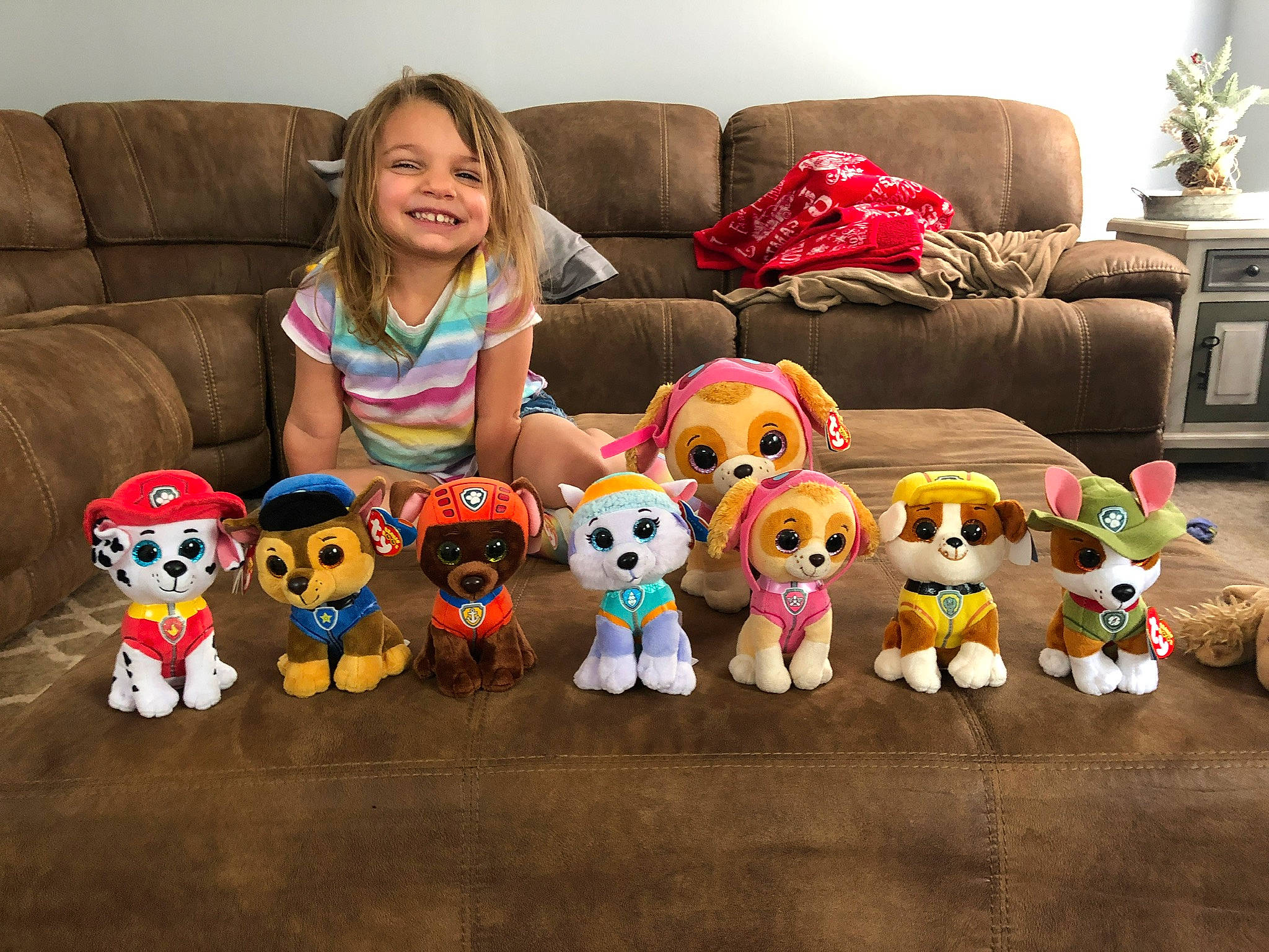 Emerie joined the competition — help win amazing prizes! child, christmas, comfort, couch, design, floor, flooring, fun, furniture, happy, joy, living_room, mammal, person, sitting, smile, stuffed_toy, t_shirt, textile, toddler