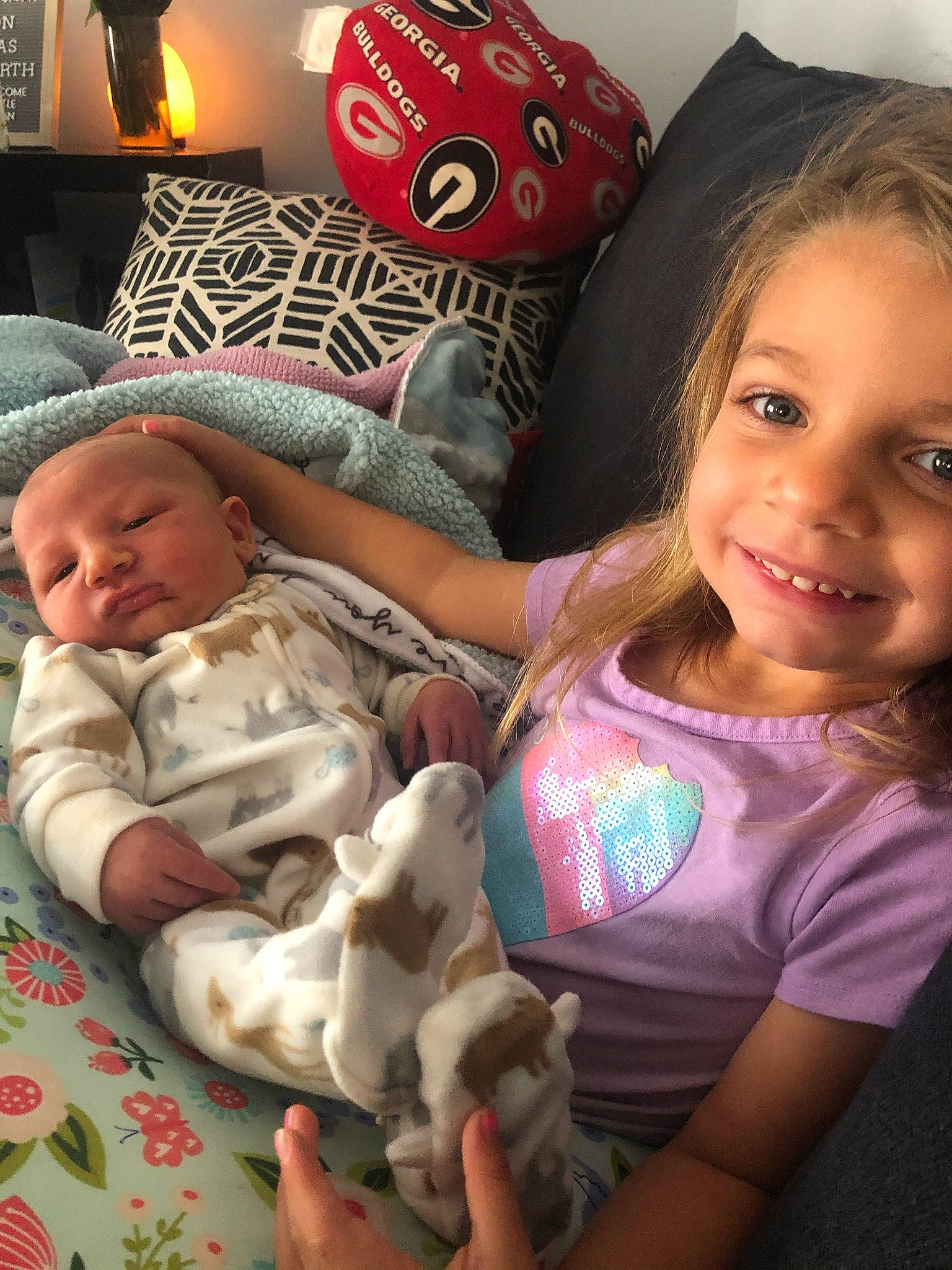 Emerie is registered to the contest to win money with this photo: baby, baby_toddler_clothing, cheek, comfort, face, facial_expression, finger, fun, happy, head, human, iris, joy, lamp, lap, mouth, person, skin, smile, toddler