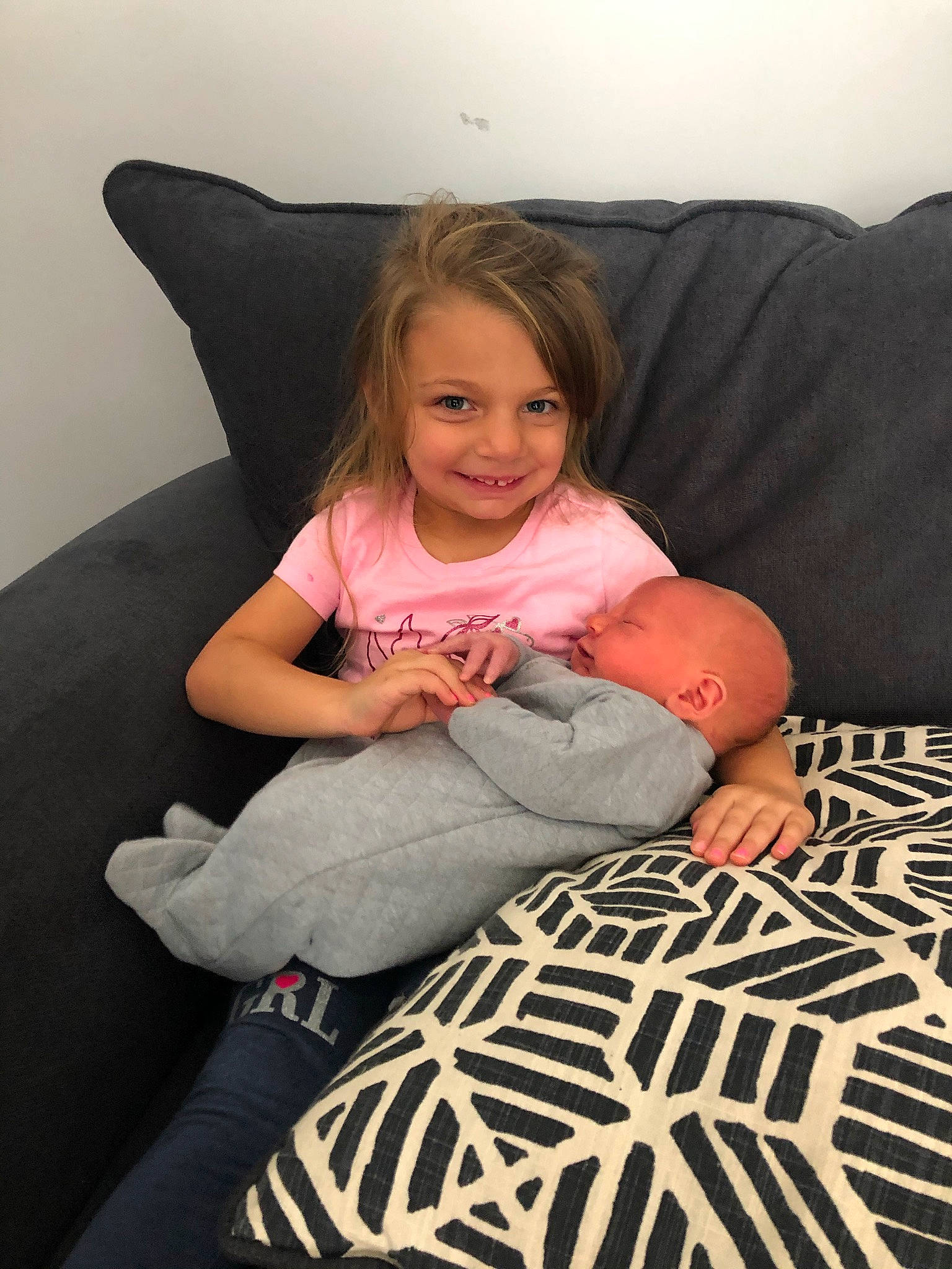 Emerie is registered to the contest to win money with this photo: beauty, bedding, comfort, couch, finger, flash_photography, flooring, fun, happy, human_leg, joy, knee, linens, person, pillow, room, sitting, smile, t_shirt, textile