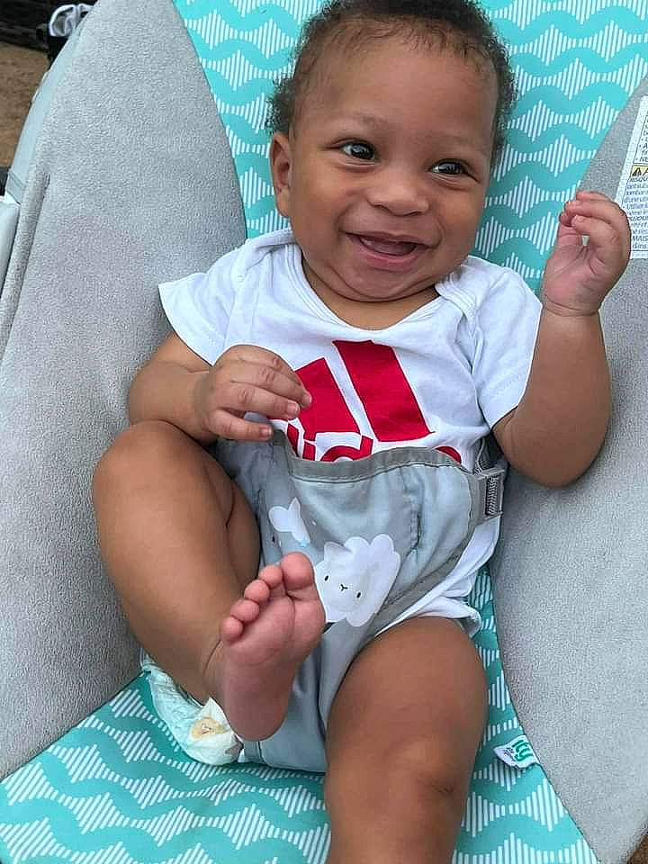 Carson joined the competition — help win amazing prizes! baby, baby_toddler_clothing, cheek, child, comfort, eye, face, facial_expression, finger, gesture, happy, human_leg, joy, mouth, person, sitting, skin, sleeve, smile, thigh
