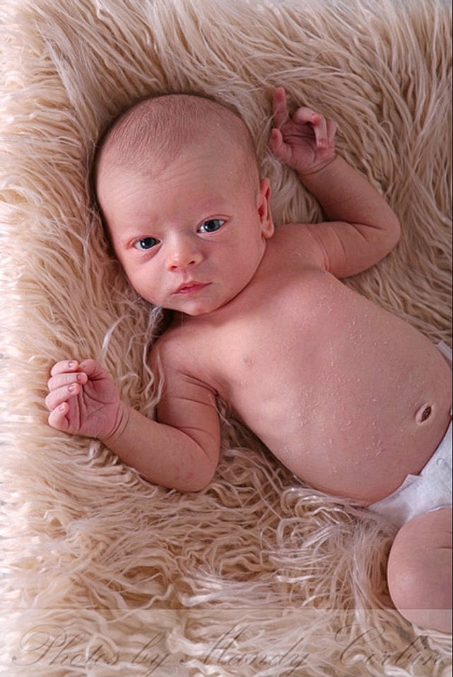 Brendan is registered to the contest to win money with this photo: baby, baby_toddler_clothing, cheek, chest, child, comfort, eye, fashion_accessory, flash_photography, fur, happy, iris, linens, lip, peach, person, sitting, skin, textile, toddler
