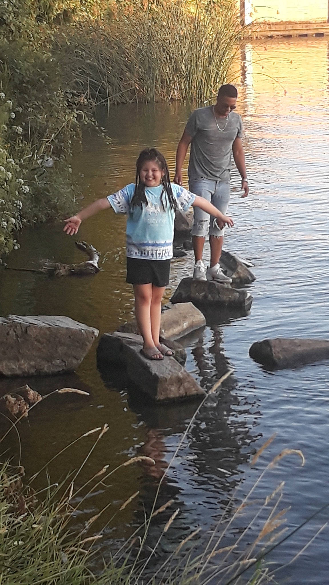 Elsie is registered to the contest to win money with this photo: bank, fun, joy, person, pond, reflection, water, water_resources, watercourse