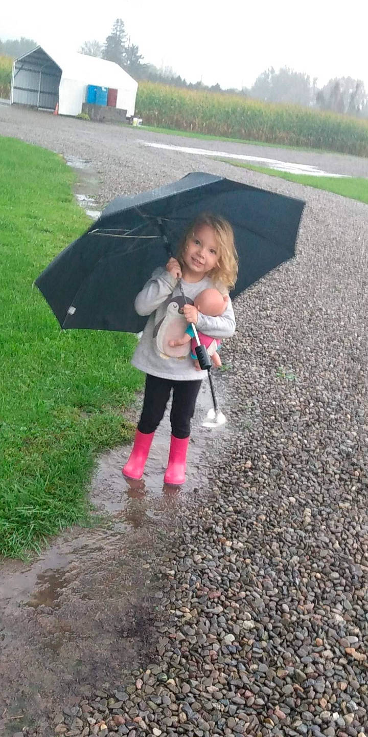 Katelyn is registered to the contest to win money with this photo: asphalt, baby, child, fashion_accessory, fun, grass, joy, lawn, leaf, leisure, people_in_nature, person, pink, plant, recreation, road_surface, shade, sidewalk, soil, toddler