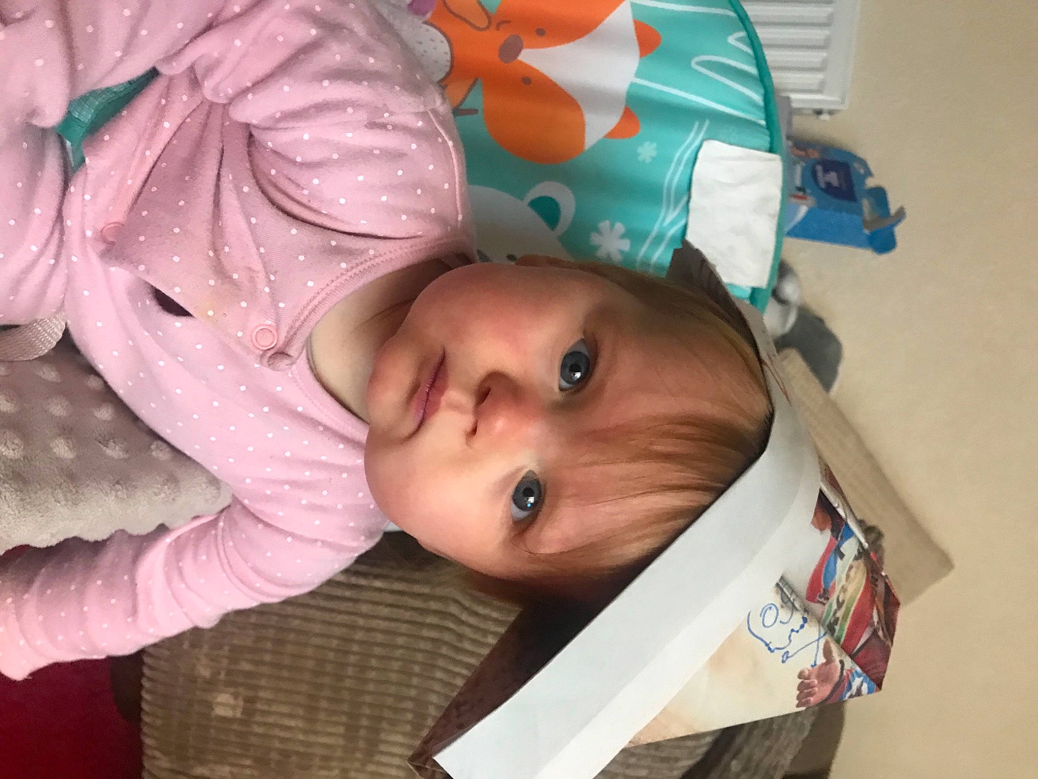 Josie is registered to the contest to win money with this photo: baby, baby_products, baby_toddler_clothing, cheek, child, comfort, eyebrow, eyelash, headgear, iris, linens, nose, person, room, skin, sleeve, toddler, tree