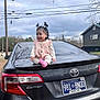 Melani joined the competition — help win amazing prizes! camry, car, child, clothing, cloudy_sky, happy, house, license_plate, nature, outdoor, person, pigtails, pink_socks, road, smiling, suburban, toddler, toyota, tree, vehicle