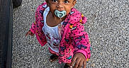 Genesis joined the competition — help win amazing prizes! toddler, child, pacifier, pink_jacket, hair_clips, curly_hair, outdoor, gravel, car, footwear, white_shirt, reaching_hand, cute, expression, standing, person, young_child, casual_clothing, daylight, curiosity