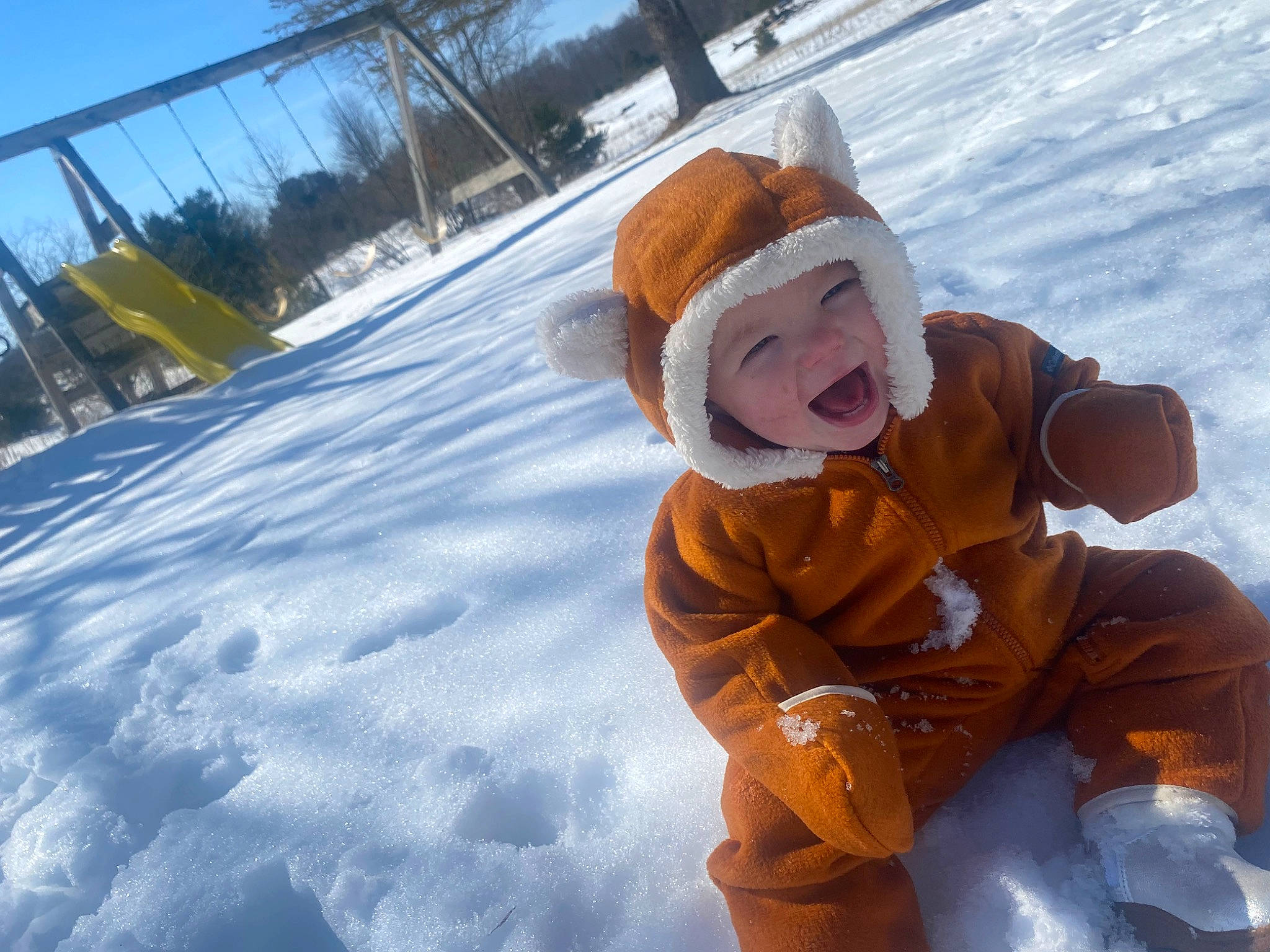 Ocean Rae is registered to the contest to win money with this photo: child, freezing, fun, glove, happy, hat, headwear, leisure, people_in_nature, person, personal_protective_equipment, play, playing_in_the_snow, playing_with_kids, recreation, sky, slope, smile, snow, toddler