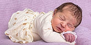 Louméa participe au concours pour gagner de l'argent avec cette photo : newborn, baby, sleeping, infant, soft, blanket, purple, cozy, cute, peaceful, teddy_bear_print, clothing, portrait, resting, child, small, delicate, face, skin, hand