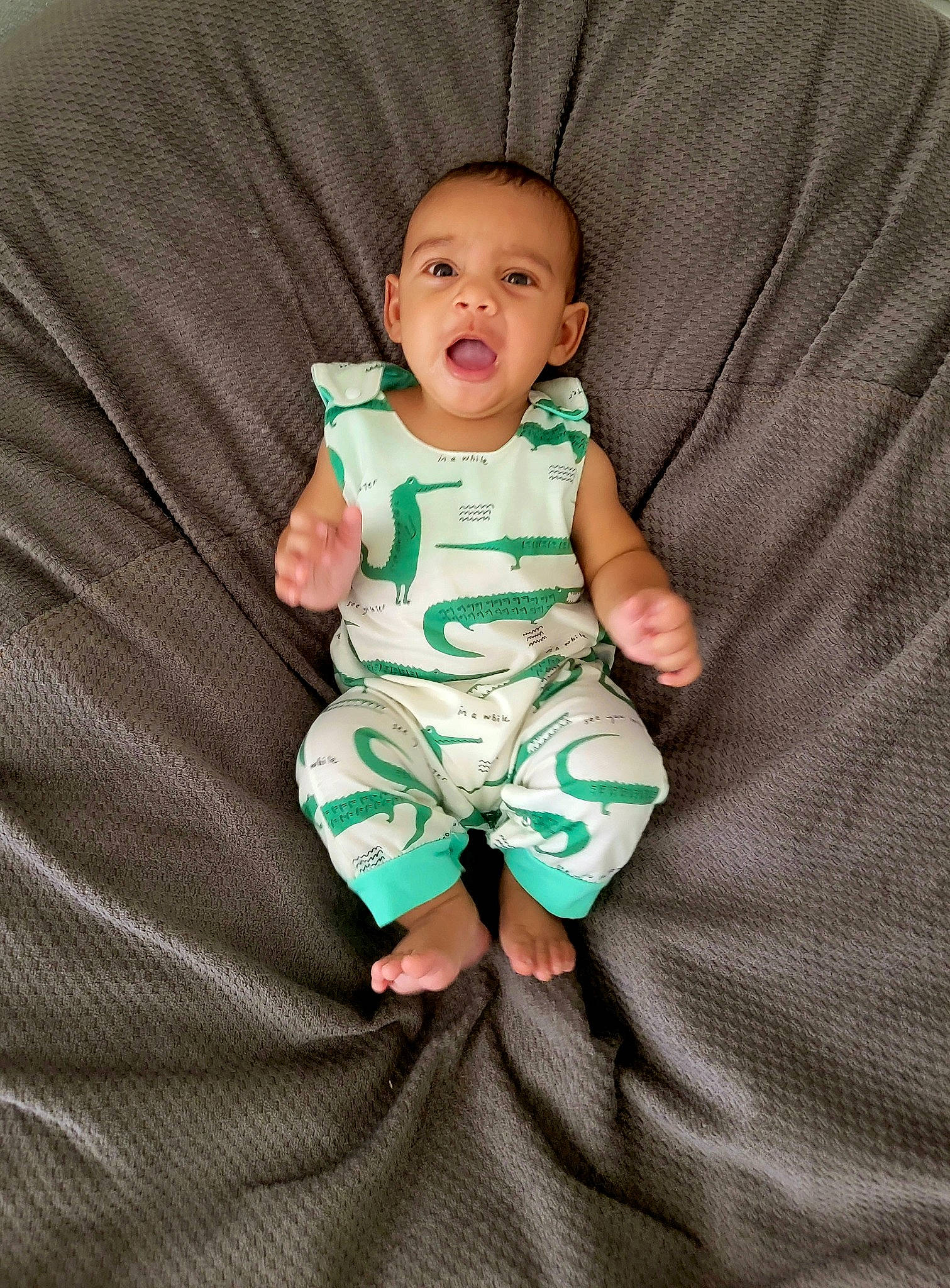 Cassius joined the competition — help win amazing prizes! baby, baby_products, baby_toddler_clothing, cheek, collar, comfort, eye, face, foot, hand, head, linens, outerwear, pattern, person, sitting, sleeve, smile, t_shirt, thumb