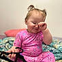 Harmony is registered to the contest to win money with this photo: toddler, child, pajamas, pink_clothing, bed, blanket, face, hand, hair, indoor, person, sleepy, holding_object, toy, cute, smiling, home, portrait, childhood, young
