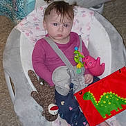 Harmony joined the competition — help win amazing prizes! baby, infant, child, baby_seat, toy, sock_monkey, book, dinosaur, clothing, floor, curtain, bed, face, person, indoor, plush_toy, pink, purple, seatbelt, foot