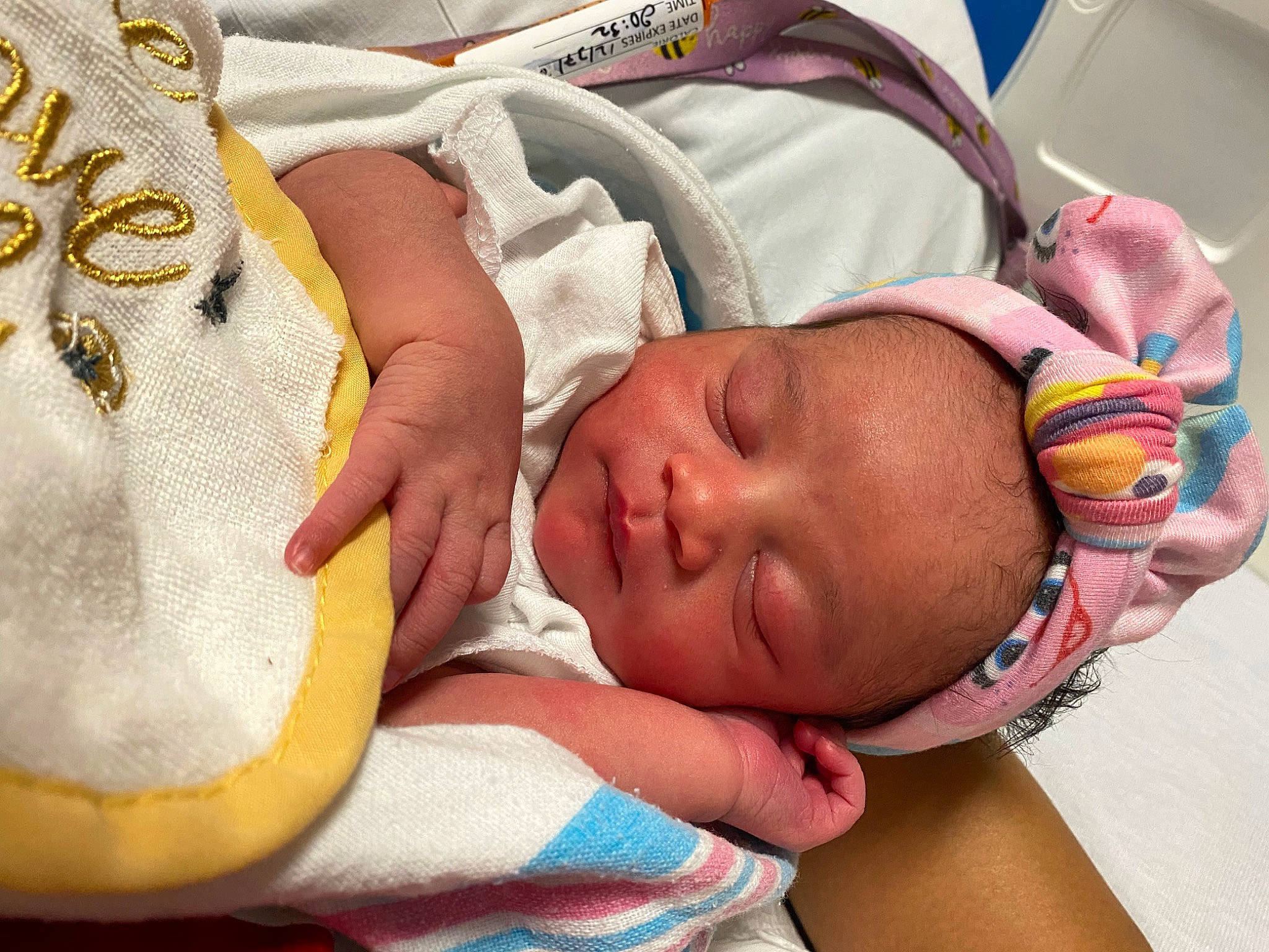 Kendall is registered to the contest to win money with this photo: baby, baby_products, baby_sleeping, baby_toddler_clothing, bedtime, cheek, child, comfort, eyelash, facial_expression, gesture, headgear, linens, mouth, nose, person, product, room, skin, textile