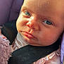 Raylynn is registered to the contest to win money with this photo: baby, infant, blue_eyes, car_seat, black_strap, pink_clothing, close_up, face, child, cute, soft_light, skin, newborn, portrait, seatbelt, young_child, expression, indoors, person, sitting