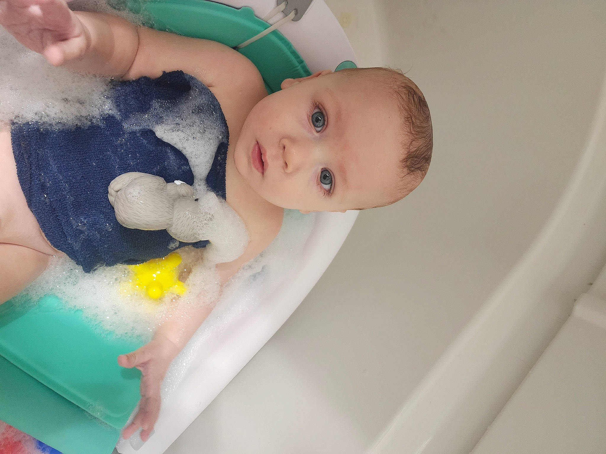 Chasyn is registered to the contest to win money with this photo: arm, baby, baby_playing_with_toys, baby_products, baby_safety, baby_toddler_clothing, bathing, bathtub, cheek, chest, child, comfort, finger, hand, infant_bed, person, skin, thumb, toddler, toy