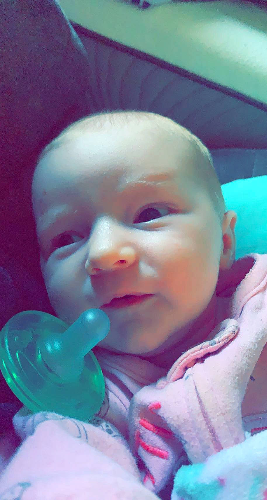 Aurora is registered to the contest to win money with this photo: baby, baby_products, baby_toddler_clothing, cheek, ear, eye, eyebrow, finger, fun, happy, headwear, iris, lip, mouth, nail, nose, person, pink, skin, smile