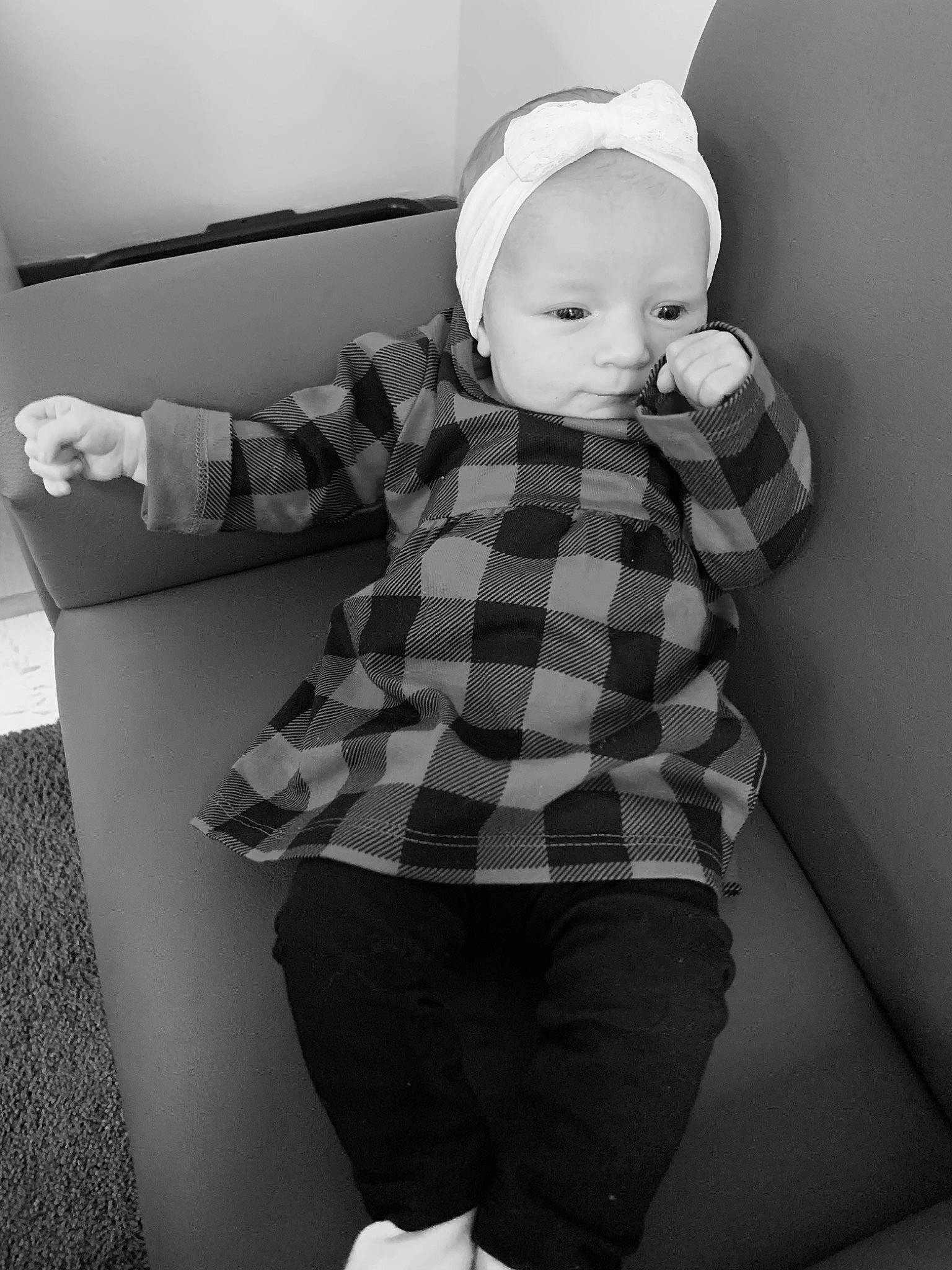 Aurora is registered to the contest to win money with this photo: baby, baby_toddler_clothing, black, black_and_white, comfort, elbow, gesture, grey, happy, knee, leg, person, shorts, sleeve, standing, style, tartan, toddler, trousers, trunk