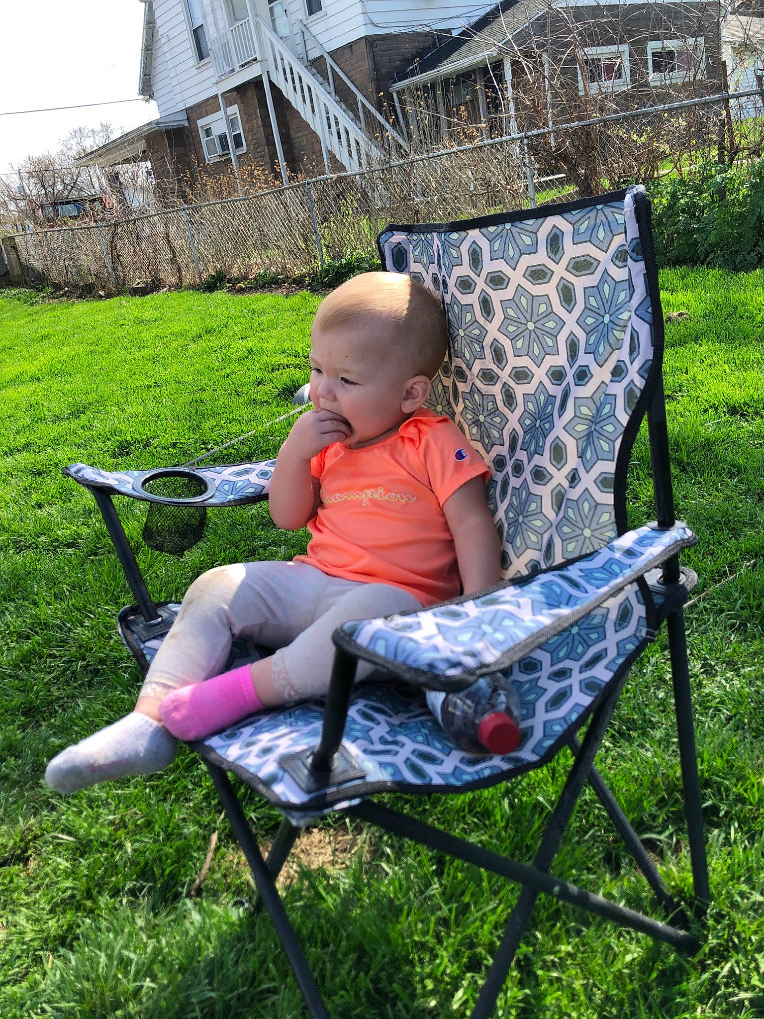Ayla joined the competition — help win amazing prizes! baby_products, backyard, chair, child, furniture, grass, lawn, leisure, outdoor_furniture, person, product, sitting, tree, vacation, yard