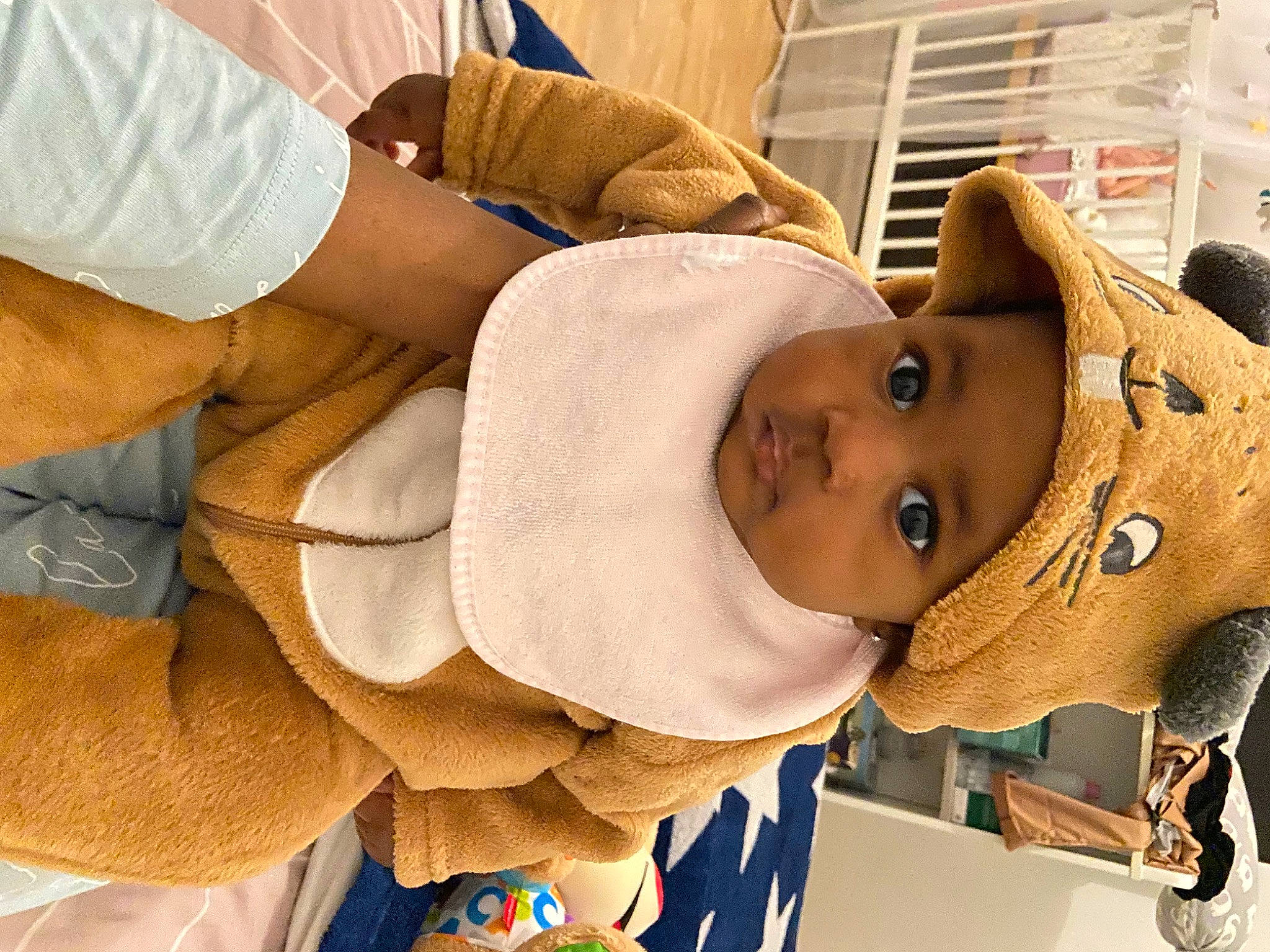 Djené participe au concours pour gagner de l'argent avec cette photo : arm, baby, baby_toddler_clothing, cap, cheek, child, comfort, eye, eyelash, fashion_accessory, fur, happy, hat, head, headwear, jacket, person, plush, room, stuffed_toy