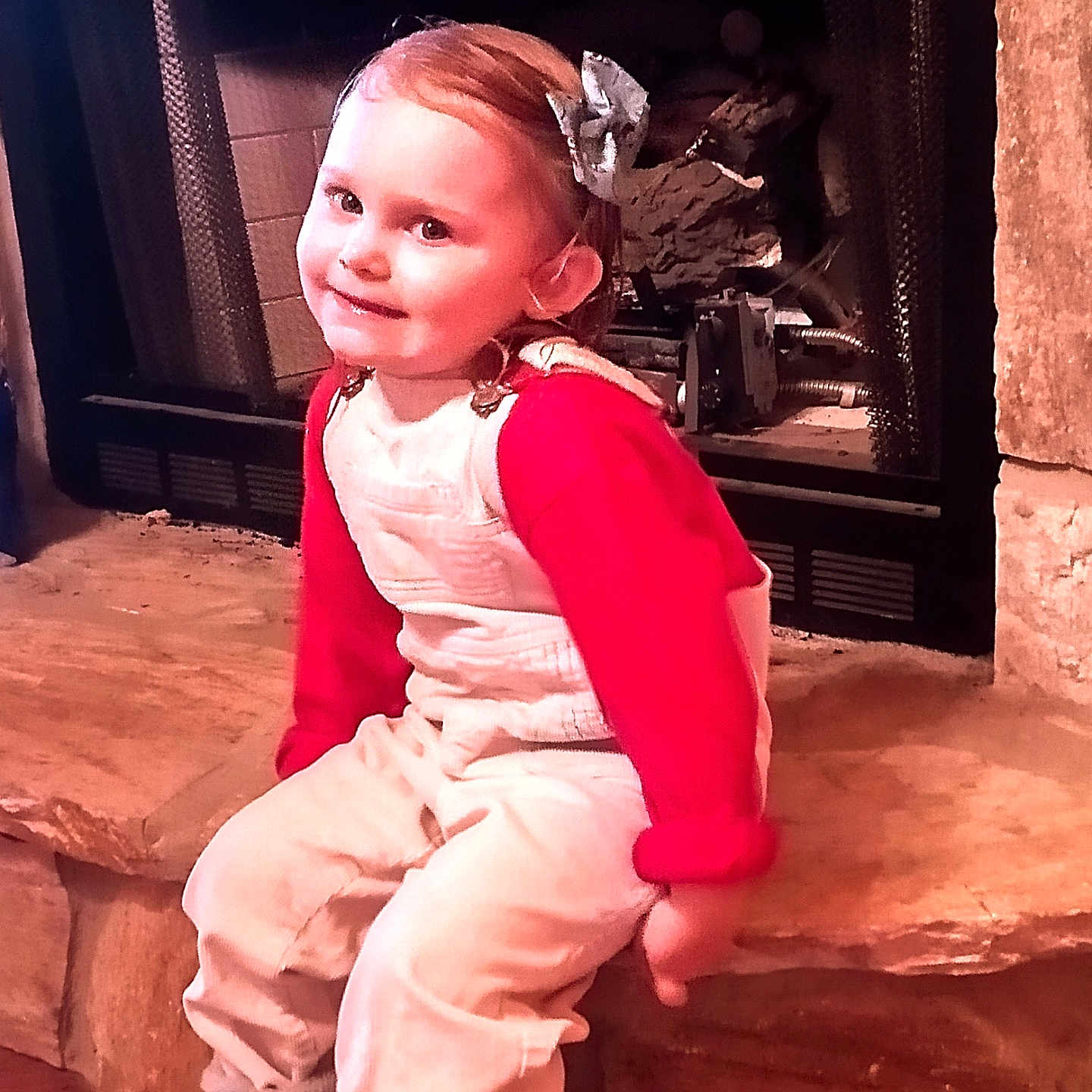 Bexlee joined the competition — help win amazing prizes! baby, bodypart, clothing, dress, face, finger, fireplace, footwear, formalwear, hand, head, hearth, indoors, pants, person, photography, portrait, shoe, sitting, wood