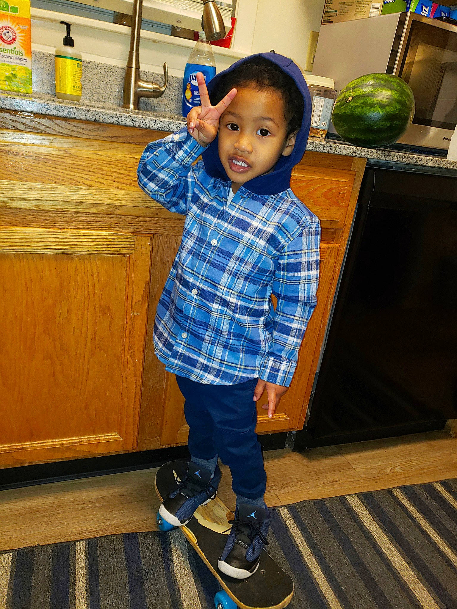 Lennox joined the competition — help win amazing prizes! blue, child, denim, electric_blue, eye, floor, flooring, footwear, fun, green, jeans, leisure, person, photograph, shoe, snapshot, standing, tartan, toddler, wood