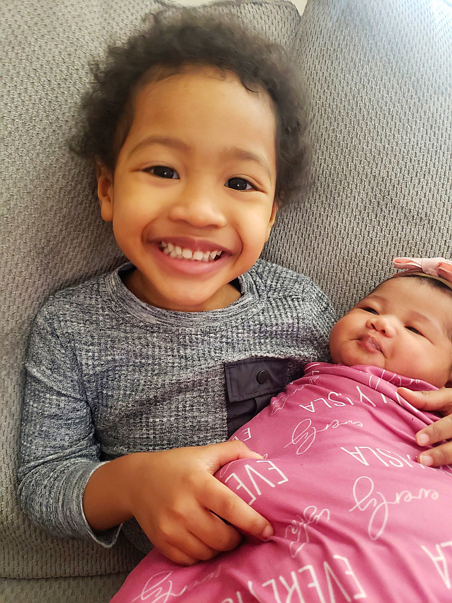 Lennox is registered to the contest to win money with this photo: baby_toddler_clothing, cheek, chin, comfort, eye, eyebrow, face, facial_expression, gesture, happy, head, iris, joy, lip, nose, organ, person, pink, skin, sleeve