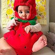 Lennen is registered to the contest to win money with this photo: baby, blanket, chair, child, clothing, costume, cute, expression, face, foot, green, hand, indoor, infant, pattern, portrait, red, sitting, soft, strawberry