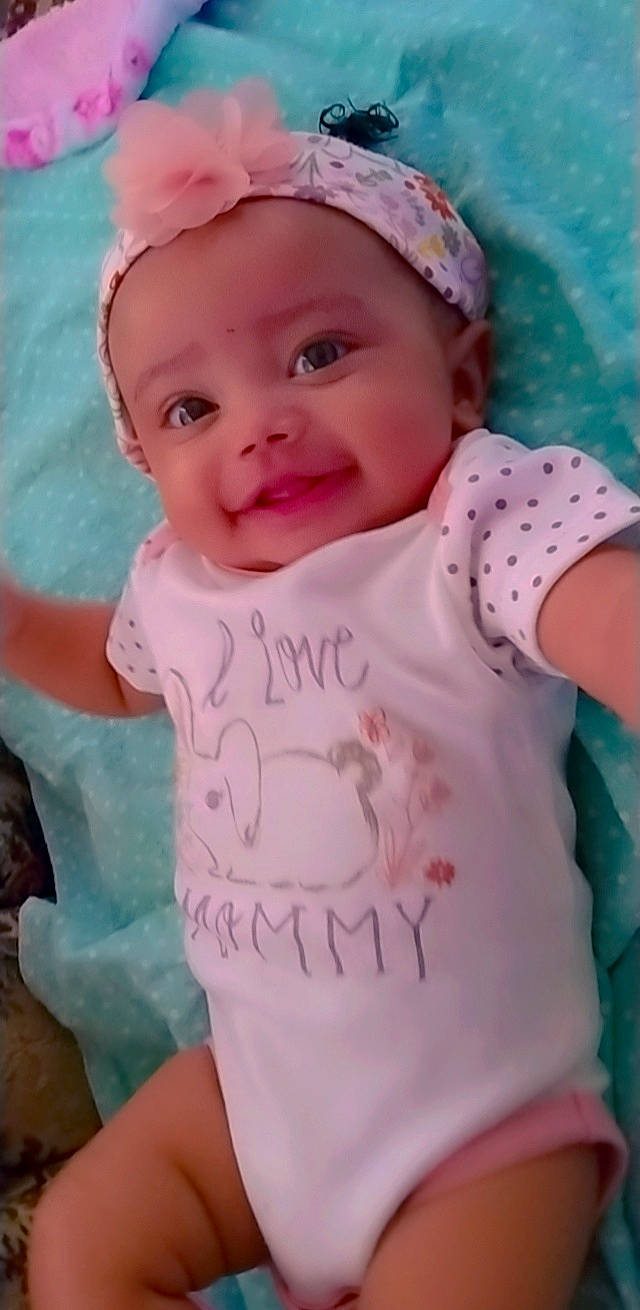 Eryss is registered to the contest to win money with this photo: baby, baby_toddler_clothing, cap, cheek, chin, clothing, eyebrow, facial_expression, hairstyle, happy, head, headwear, iris, lip, mouth, nose, person, pink, skin, sleeve