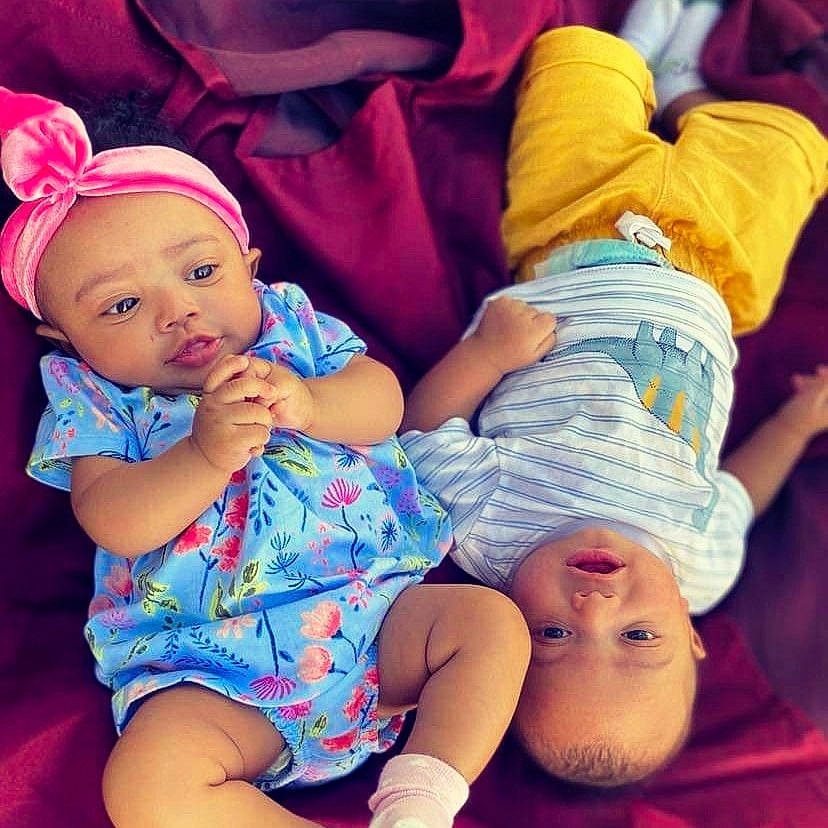 Eryss is registered to the contest to win money with this photo: arm, baby_toddler_clothing, cheek, comfort, hand, happy, head, headwear, human, human_body, interaction, leg, mammal, mouth, muscle, organ, person, product, purple, skin