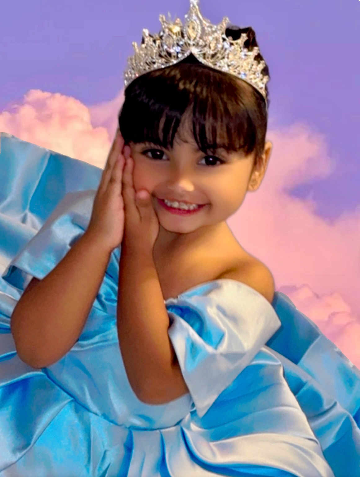Jailyne is registered to the contest to win money with this photo: child, girl, smile, princess, tiara, blue_dress, portrait, happy, face, hands, young_child, costume, fancy_dress, posing, studio, background, clouds, cute, fashion, celebration