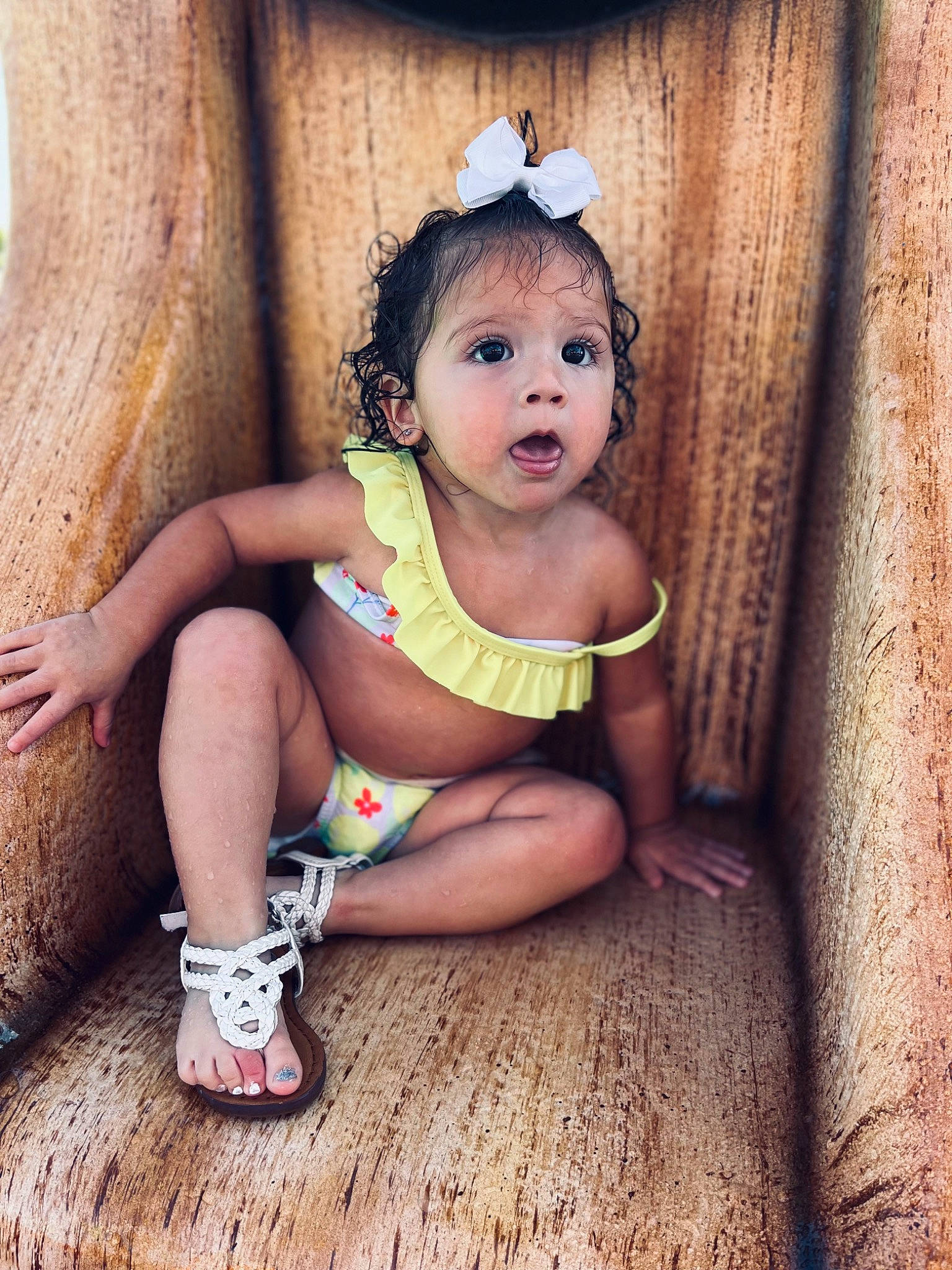 Haisley Tru is registered to the contest to win money with this photo: baby_toddler_clothing, blond, child, curtain, eyelash, fashion_accessory, flash_photography, foot, footwear, hairstyle, happy, human_body, human_leg, jewellery, knee, person, sitting, sock, surprise, thigh