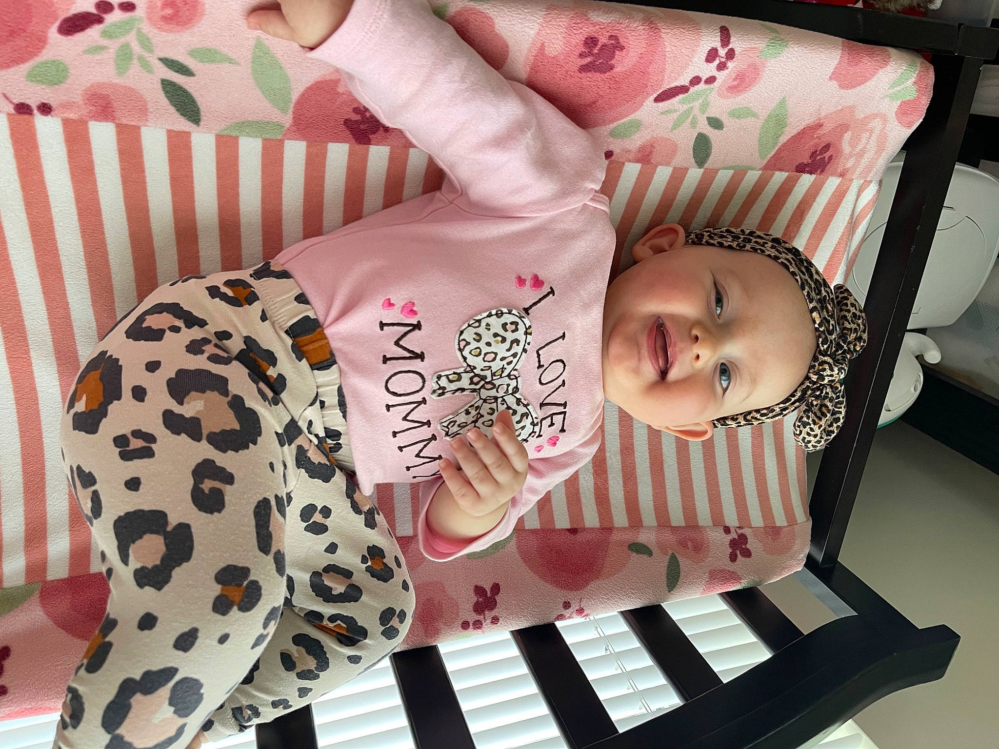 Lillian is registered to the contest to win money with this photo: baby, baby_products, baby_toddler_clothing, cheek, child, eyelash, fashion_accessory, finger, flesh, font, happy, magenta, nail, pattern, peach, person, pink, sleeve, t_shirt, toddler