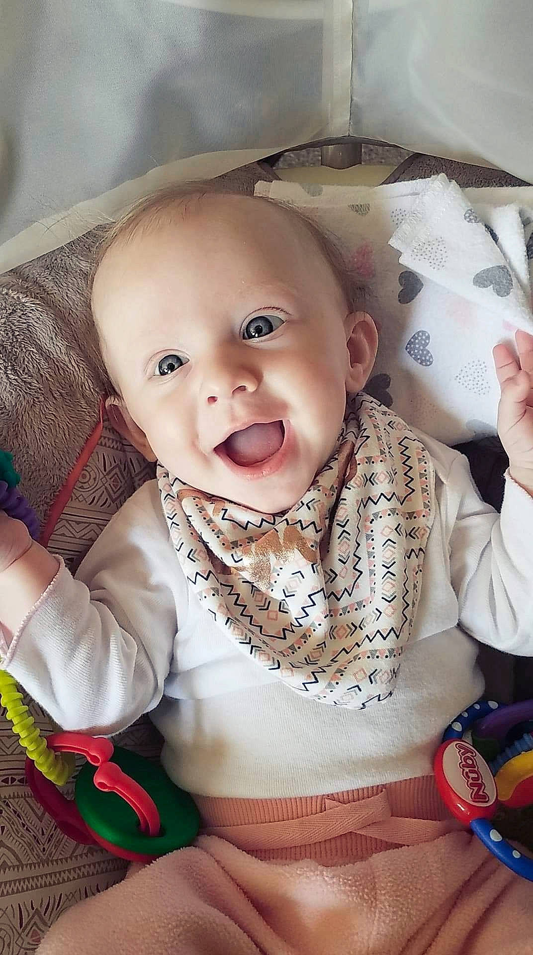 Ashlyn is registered to the contest to win money with this photo: baby, baby_products, baby_toddler_clothing, cheek, child, ear, eye, face, facial_expression, head, iris, lip, nose, person, play, product, sitting, skin, smile, toddler