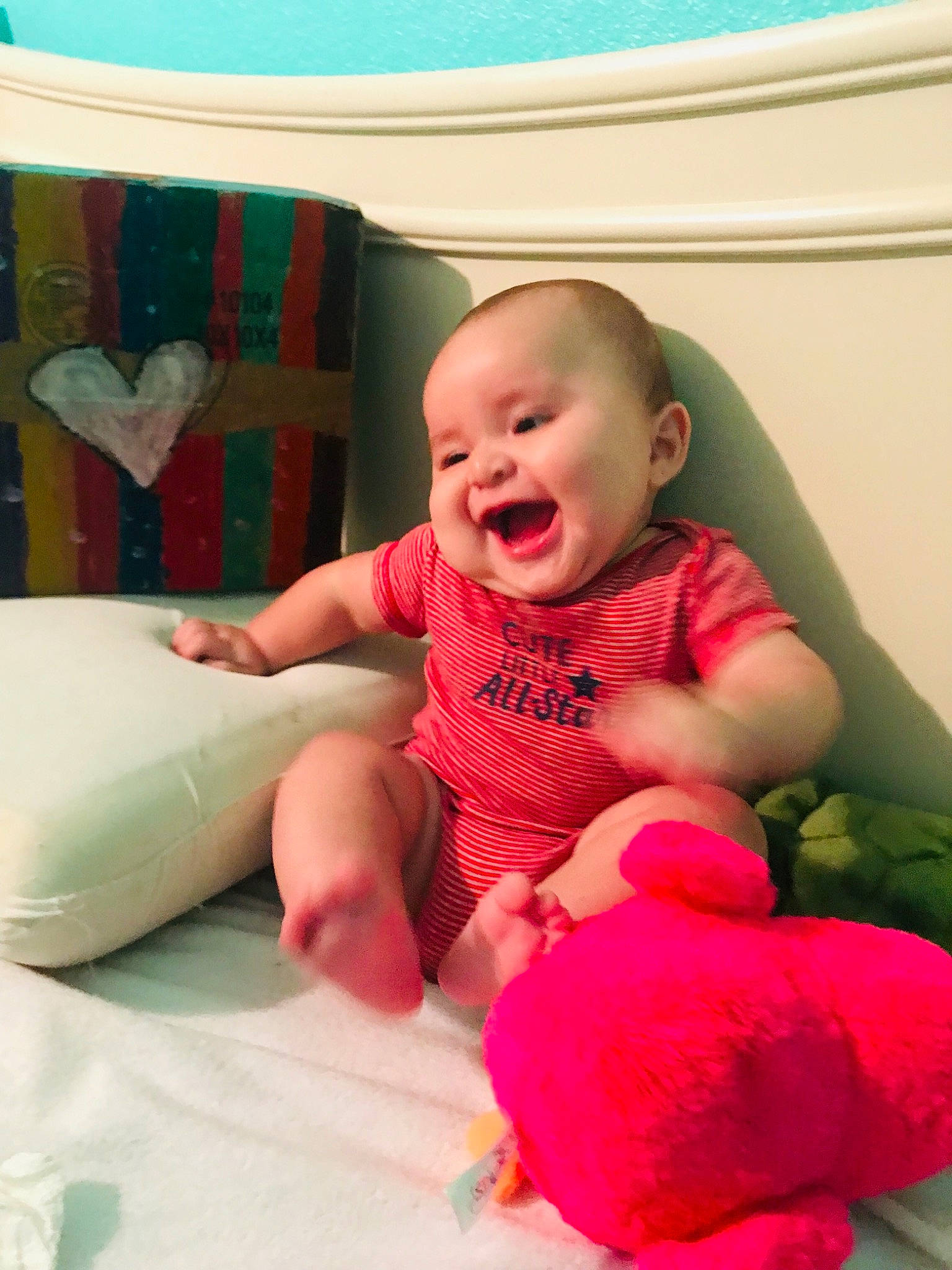 Haedy is registered to the contest to win money with this photo: baby, baby_toddler_clothing, child, person, pink, play, sitting, skin, smile, toddler