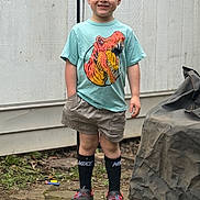 Everett joined the competition — help win amazing prizes! child, boy, smiling, tshirt, dinosaur, shorts, socks, nike, crocs, outdoor, patio, stone, grass, toy, wall, cover, casual, standing, happy, person