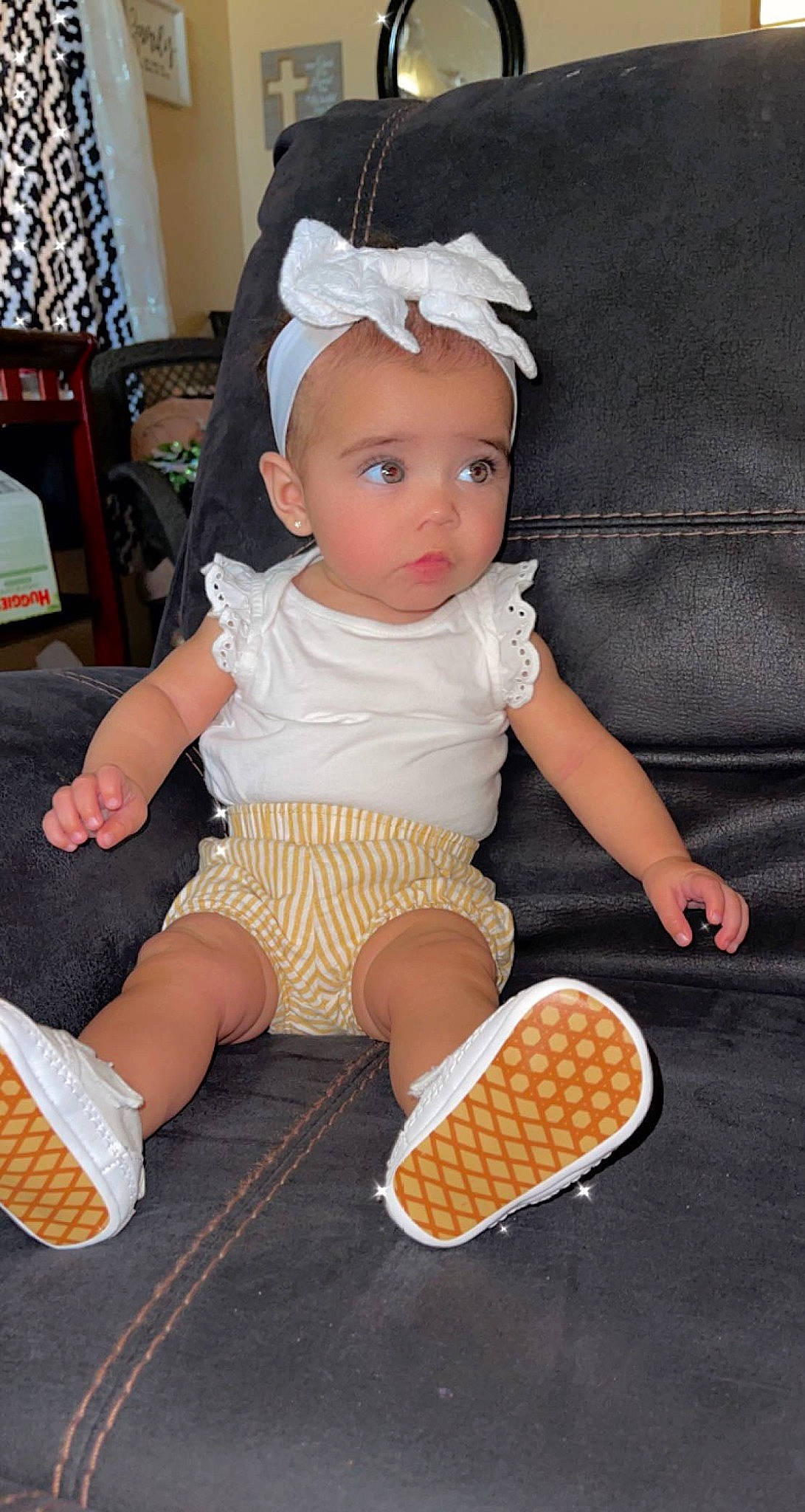 Paisley is registered to the contest to win money with this photo: baby, baby_playing_with_toys, baby_products, baby_toddler_clothing, chair, child, finger, foot, hat, human_leg, ingredient, lap, leg, pattern, person, sitting, sleeve, sock, thigh, thumb