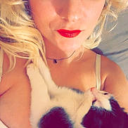 Anastasia is registered to the contest to win money with this photo: black_and_white_cat, blonde_hair, blue_eyes, cat, closeup, comfort, cuddle, face, hair, indoor, necklace, pet, portrait, red_lipstick, relaxing, skin, sleeping_cat, soft_lighting, white_bra, woman