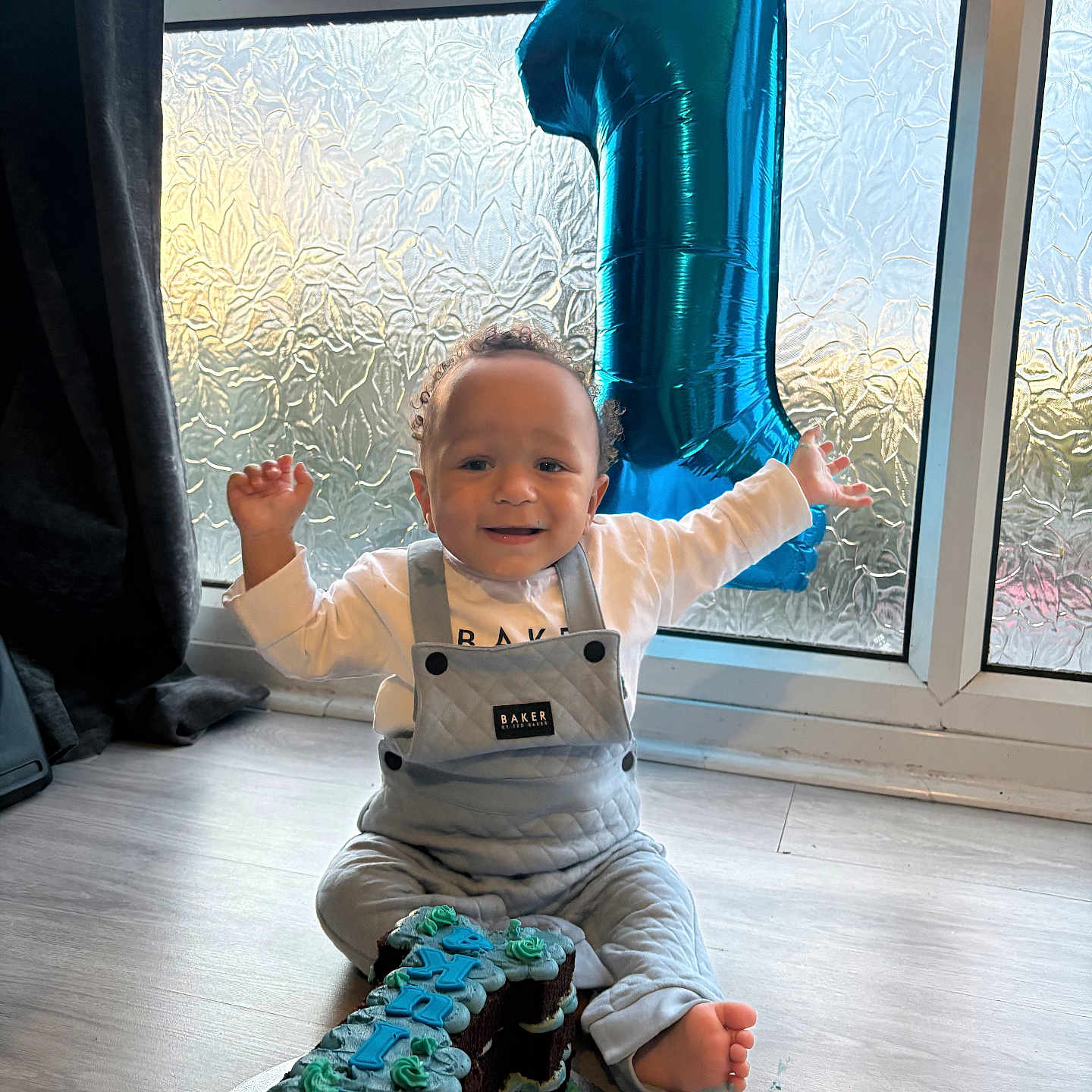 Cookie joined the competition — help win amazing prizes! baby, balloon, birthday, cake, celebration, child, clothing, curtain, decorations, floor, foot, happy, indoor, natural_light, number_one, overalls, party, person, smile, window