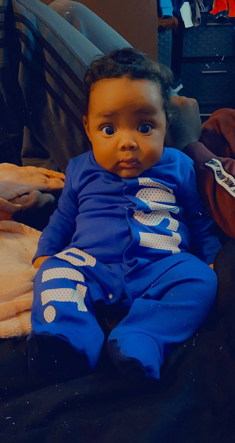 Kartier is registered to the contest to win money with this photo: baby, blue, cheek, child, cool, eye, face, head, lip, mouth, person, sitting, skin, toddler