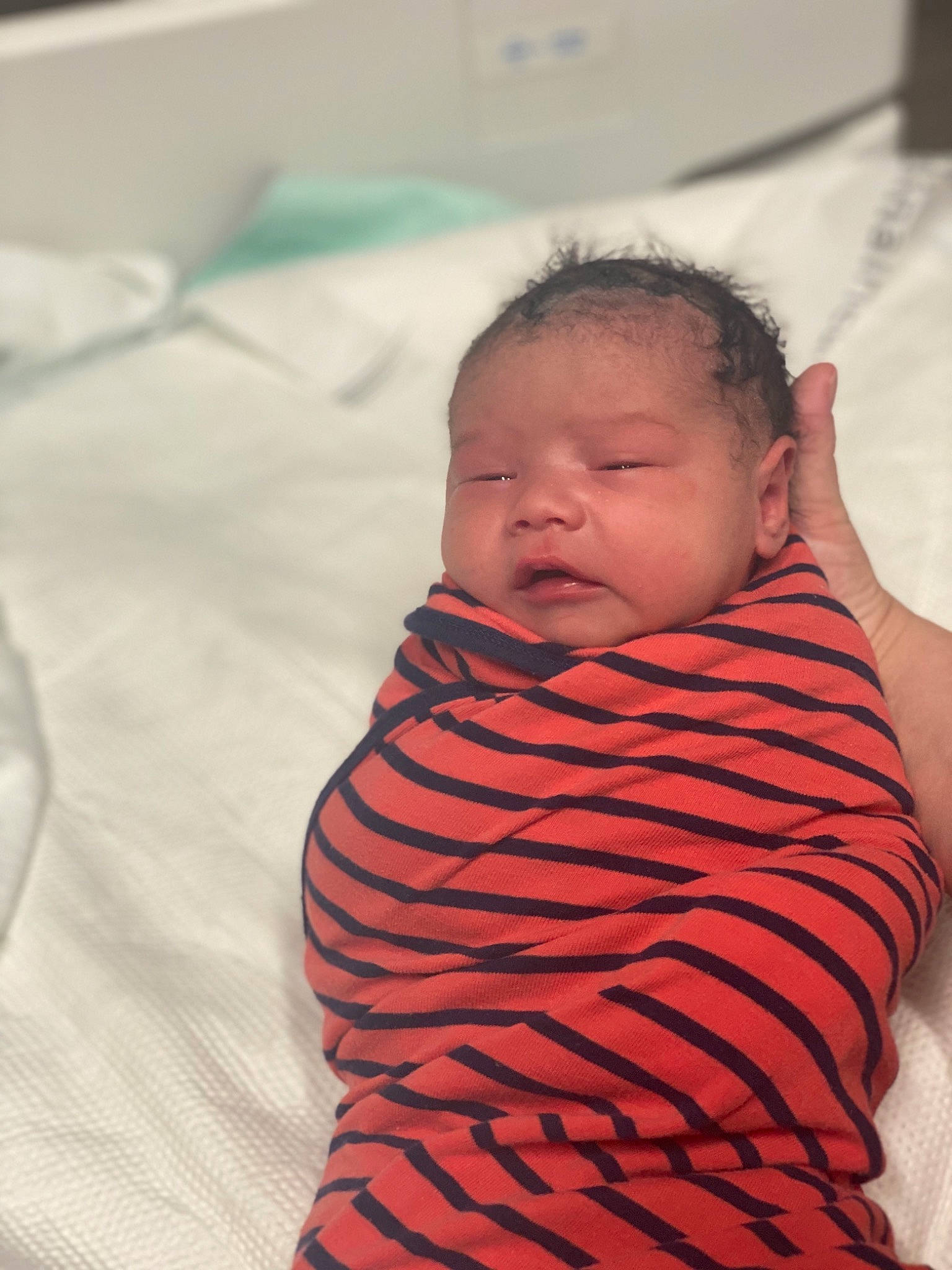 Waylon is registered to the contest to win money with this photo: baby, baby_toddler_clothing, cheek, comfort, eye, eyebrow, face, facial_expression, forehead, head, human_body, iris, lip, mouth, neck, nose, person, skin, sleeve, textile