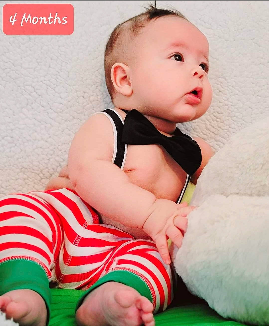 Adriel joined the competition — help win amazing prizes! baby, baby_products, baby_toddler_clothing, cheek, child, collar, comfort, dress, face, happy, human_leg, neck, pattern, person, product, sitting, skin, sleeve, stomach, thigh