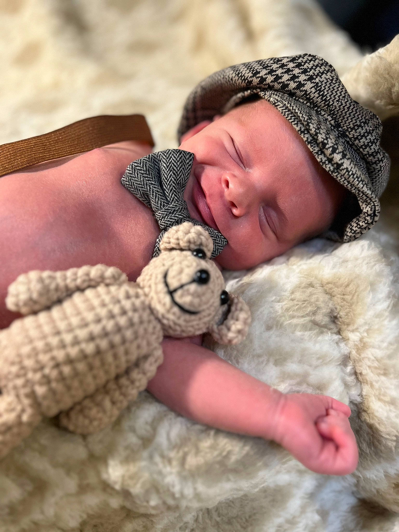 Jesse is registered to the contest to win money with this photo: baby, baby_sleeping, cap, comfort, fawn, finger, gesture, happy, hat, headwear, mammal, nail, pattern, person, skin, stuffed_toy, textile, thumb, toddler, toy