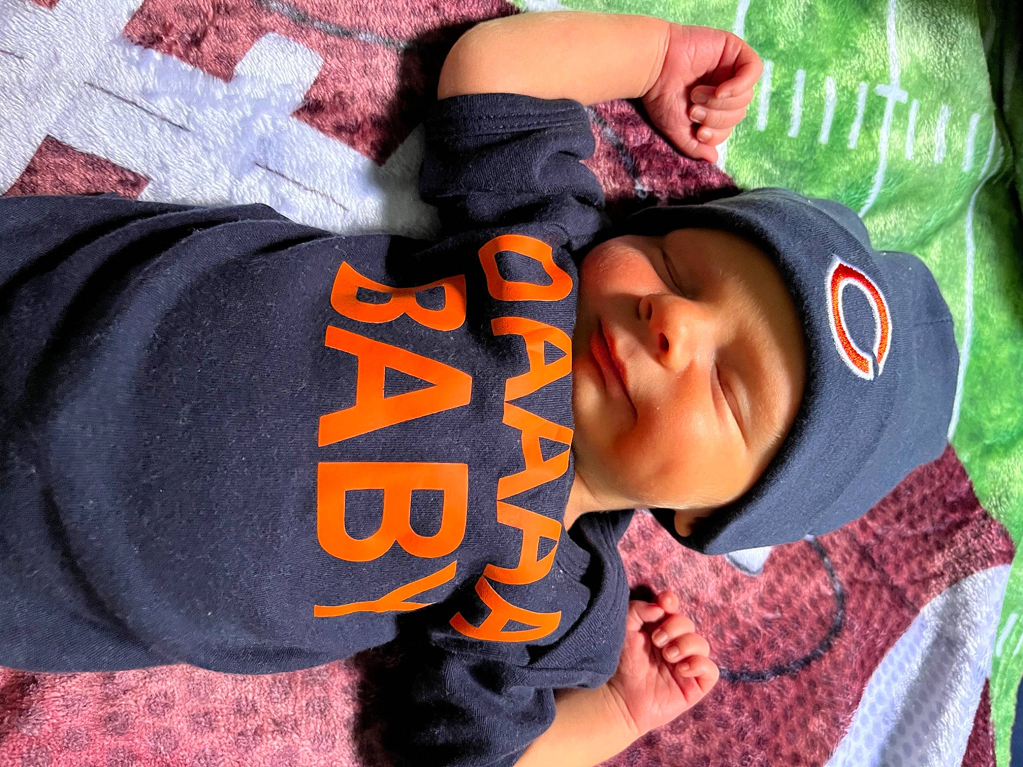 Jesse is registered to the contest to win money with this photo: child, comfort, font, fun, happy, headwear, pattern, person, sleeve, smile, textile, thumb, toddler, tree, wrist